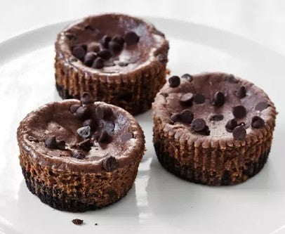 Protein Breakfast Cheesecake with Hazelnuts, Dark Chocolate Drizzle & Cacao Nibs