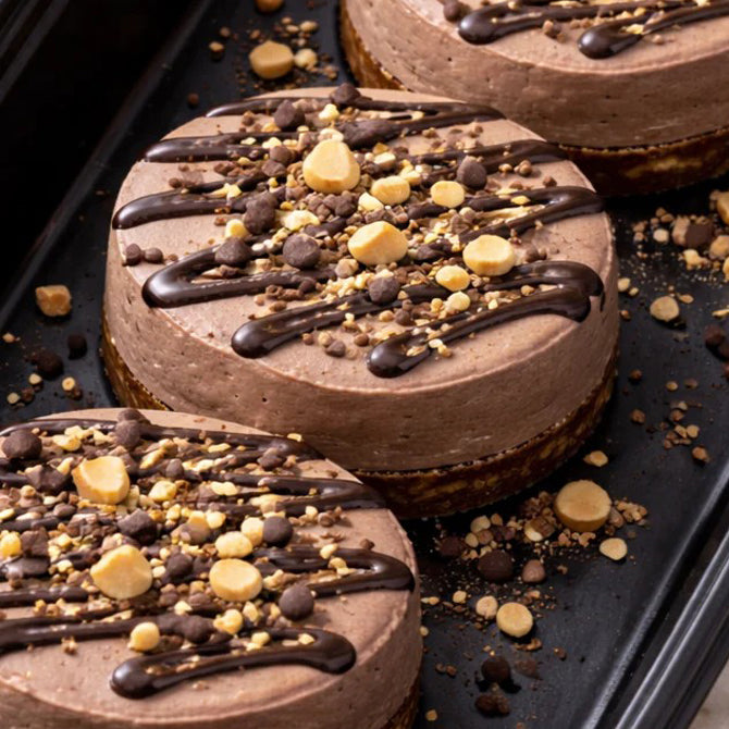 Protein Breakfast Cheesecake with Hazelnuts, Dark Chocolate Drizzle & Cacao Nibs
